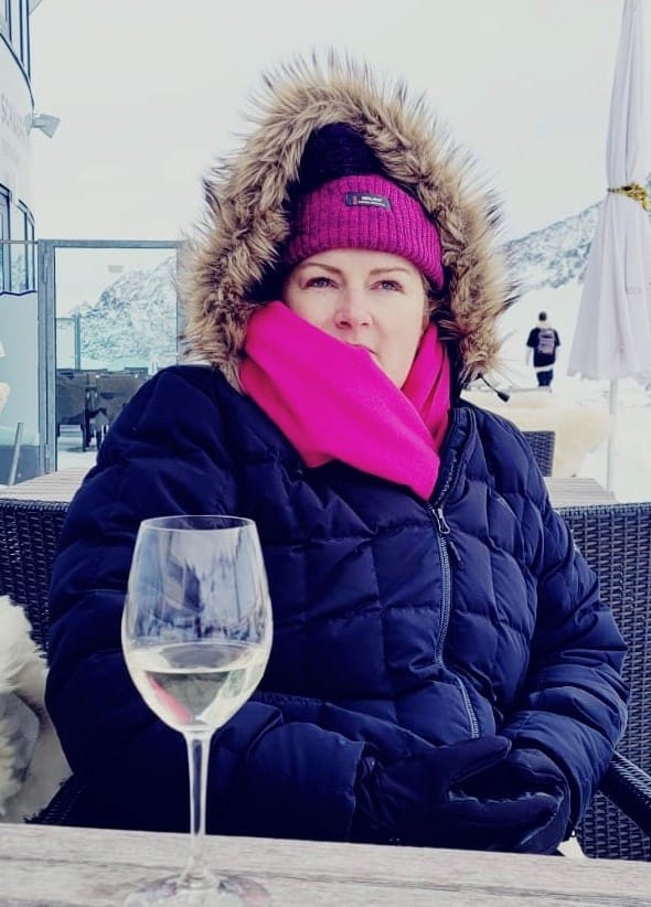 Jade Mulroney at the ski resort wearing a parka